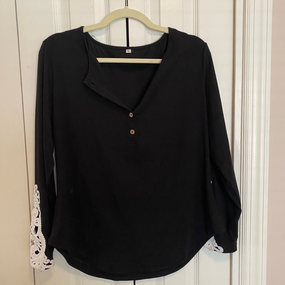 Women’s black Henley, long sleeve shirt with crocheted insert on sleeve
